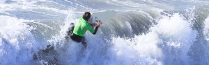 Image of San Diego surfer in the curl of a wave