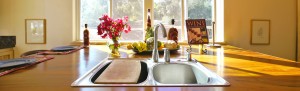 Dramatic sun-streaked image of the kitchen of a fine home in Fallbrook California